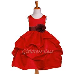 a red flower girl dress on a mannequin