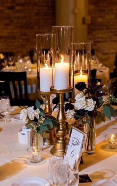 the centerpieces are adorned with candles and flowers