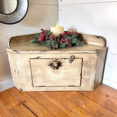 an old trunk is decorated with greenery and a candle