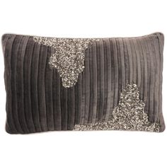 a gray velvet pillow with silver sequins on the front and back, along with an embroidered cow head