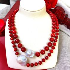 This handmade necklace is made of red corals with baroque pearls with Japan golden plated brass findings. It's beautiful and brilliant and can be matched with a midi dress, tube top, or knitwear from day to night for any occasion. Match it with Farra earrings to complete your look. Also, this is a very nice gift for birthdays, anniversaries or festivals. It will be contained in a nice jewelry box. Elegant Red Beaded Pearl Necklace, Elegant Red Coral Round Bead Necklaces, Elegant Red Coral Round Bead Necklace, Elegant Red Coral Beaded Necklace, Elegant Single Strand Red Coral Necklaces, Elegant Single Strand Red Coral Necklace, Elegant Red Pearl Necklace With Gemstone Beads, Elegant Beaded Red Coral Pearl Necklace, Elegant Red Coral Beaded Pearl Necklace