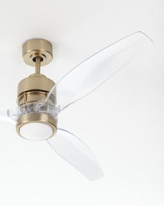 a ceiling fan with a clear glass blade