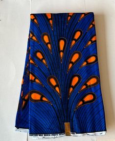 African  Ankara  Fabric   Material: 100% Cotton Print: Double - Sided Width:  45 - 46" Main colors: Blue , Orange, Black FABRIC CUT: Purchase of  more than 1 yard,  will be cut as 1  continuous piece of fabric up to a maximum length of 6 yards.  MANUFACTURER's LABELS: All African fabric is sold with an adhesive Manufacturer label attached This timeless appeal & adorable, vibrant color African print fabric is perfect for making African Clothing, African Quilts, Upholstery, Home Décor, Unique Acce Blue Printed Ankara Fabric, African Quilts, African Ankara, Unique Accessories, African Print Fabric, Ankara Fabric, African Fabric, African Clothing, Accessories Unique