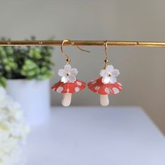 Our lovely mushroom umbrella earrings are made with resin mushroom and 14k gold plated earring hook which are good for delicate ears. Size: the length is about 1.5" Mushroom Design Dangle Earrings As Gift, Cute Dangle Earrings With Mushroom Design, Mushroom Design Drop Earrings, Whimsical Mushroom Drop Earrings, Whimsical Mushroom-shaped Earrings For Gifts, Spring Red, Food Earrings, Xmas Holidays, Gold Plated Earrings