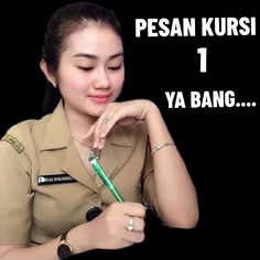 a woman in uniform writing on a piece of paper with the words pesan kursi 1 ya bang