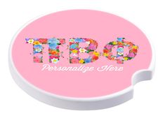 personalized coaster with flowers and the word bob on it in white letters against a pink background