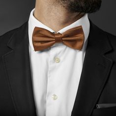 Handsome, classic brown. This staple accessory goes with just about anything. Complement earth tones or create a bold contrast with contrasting colours. Designed for the big and tall gentleman. Pre-tied and easy to wear. Formal or casual, you're good to go. Golden Bow, Pre Tied Bow Tie, Tie Design, Champagne Color, Simple Dresses, Winter Wonderland, Bow Tie, Contrasting Colors, Champagne