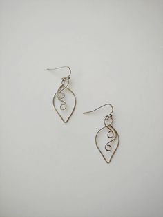 "These simple leaf shaped wire earrings are super simple and will compliment just about any outfit! 100% stainless steel wire and earring hooks. They hang approximately 1.25\" down from earring hook. Earrings will come on an earring card with plastic earring backs. All my jewelry is handmade, and made with patience, care and love. In the unlikely event that it needs to be repaired, I'll do it free of charge." Nature-inspired Dangle Earrings With Ear Wire, Nature-inspired Wire Wrapped Earrings For Gifts, Leaf-shaped Earrings With Ear Wire For Gift, Bohemian Leaf-shaped Jewelry With Ear Wire, Minimalist Nickel-free Leaf-shaped Earrings, Leaf-shaped Brass Earrings With Ear Wire, Wire Leaf, Citrine Earrings Studs, Simple Leaf