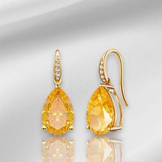 💎 Jewelry Details: *Metal: 14K Solid Gold *Gemstone:    - Type: Citrine    - Cut: Pear    - Color: Yellow    - Clarity: Eye-Clean    - Size: 8 x 10 mm    - Total Carat Weight (CTW): 5.20 *Diamonds:    - Color: Gold   - Clarity: VS    - Total Carat Weight (CTW): 0.05 *Measurements:    - Length: 3/4 inch    - Width: 1/2 inch 🪄 Pear-Cut Meaning:  The Pear-Cut is renowned for its timeless elegance and sophistication. Characterized by its teardrop shape and unique facets, this cut highlights the cl Yellow Gold Gemstone Teardrop Earrings, Elegant Gold Teardrop Earrings With Gemstone, Elegant Pear-shaped Topaz Jewelry, Formal Teardrop Citrine Jewelry, Formal Yellow Gold Topaz Earrings, Yellow Gold Pear-shaped Citrine Jewelry, Yellow Gold Pear-shaped Teardrop Earrings, Yellow Gold Pear Shaped Teardrop Earrings, Pear-shaped Citrine Jewelry In Yellow Gold