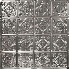 a close up view of a metal door with decorative designs on the front and sides