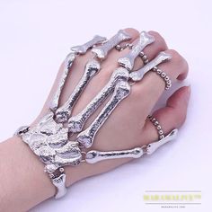 SPECIFICATIONSBrand Name: VysshiyGender: UnisexMaterial: MetalMetals Type: Zinc alloyBracelets Type: Chain & Link BraceletsOrigin: Mainland ChinaCN: ZhejiangChain Type: OtherItem Type: BraceletsClasp Type: Hidden-safety-claspCompatibility: All CompatibleShape\pattern: SkeletonModel Number: BraceletSetting Type: NoneFine or Fashion: FashionStyle: PunkFunction: OtherOccasion: Anniversary Engagement Gift Partyring: Diameter 4cmPacking: OPP BagSale Methods: Retail; wholesale; dropshippingis_customiz Skeleton Hand Bracelet, Hand Bracelet With Ring, Skeleton Bracelet, Bone Hand, Halloween Skeleton Hand, Women Skeleton, Finger Bracelets, Gothic Bracelet, Gothic Chic