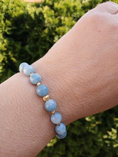 **Discover the Elegance of Our 14k Gold Angelite Beaded Bracelet** Embrace the refined beauty and spiritual healing properties of our 14k Gold Angelite Beaded Bracelet. Each of the 8mm blue healing crystal beads is meticulously hand-selected and strung to create a stunning wristpiece that is as elegant as it is meaningful. Angelite is renowned for its calming energies that promote tranquility and peace, making this bracelet not just a jewel, but a wearable source of serenity. Whether you're trea Bracelet Stands, Bracelet Elegant, Birthday Gift For Women, Crystal Healing Bracelets, Handcrafted Bracelets, Jewelry Birthday, Touch Of Gold, Spiritual Healing, Crystal Bracelet