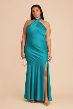 a woman in a long turquoise dress