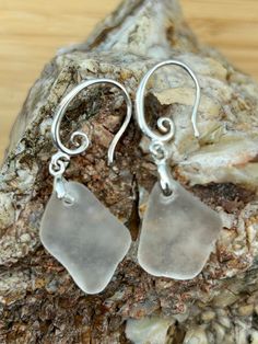 ✨ Each piece of genuine sea glass in this stunning pair of earrings. was lovingly handpicked from the sun-kissed shores of Aruba, in September 2024 🌊. After being gently washed, dried, and carefully sorted, these unique treasures of the ocean are matched to create a truly one-of-a-kind drop earrings 💎. Each sea glass gem is top-drilled with precision, secured with beautiful findings, and given a delicate rub of mineral oil to bring out its mesmerizing brilliance. For an extra touch of luxury, Nickel-free Teardrop Earrings In Recycled Glass, Nickel-free Teardrop Earrings Made Of Recycled Glass, Teardrop Sea Glass Earrings With Ear Wire, Silver Hypoallergenic Sea Glass Earrings, Silver Hypoallergenic Earrings With Sea Glass, Hypoallergenic Silver Sea Glass Earrings, Elegant Recycled Glass Earrings With Ear Wire, Elegant Silver Sea Glass Earrings, Nickel-free Sea Glass Earrings For Jewelry Making