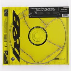 a cd with barbed wire around it on a white background and yellow backround