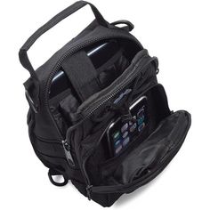 an open black backpack with cell phones in the pocket and zippers on the side