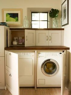 a washer and dryer in a small room