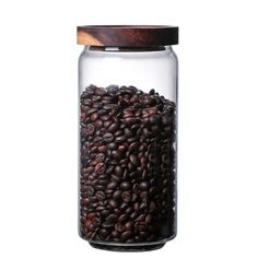 a glass jar filled with coffee beans