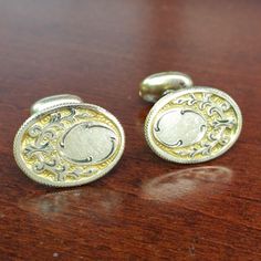 Beautiful Edwardian-era Gold Cufflinks from W.G.C. featuring a fantastic hand engraved and chased floral filigree pattern! Circa 1900's-1910's these classic pieces feature a beautiful gold filled front and toggle tested between 10k-14k, with a small blank space on the face for a jeweler to add a personalized monogram or initials. These antique cufflinks are in fantastic condition with some light signs of age and gentle wear, please note one of the toggles is slightly shortly than the other howev Gold Cuff Links, Antique Cufflinks, Wedding Cuff Links, Pearl Cufflinks, Wedding Cuff, Wedding Cufflinks, Floral Filigree, Filigree Pattern, Formal Suit