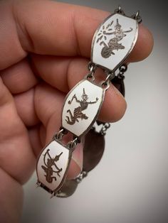 "Gorgeous and iconic sterling silver bracelet from Thailand. This style is well known and highly collectable. Known as Siam or \"dancing Siam.\" Each segment depicts and elegant Thai dancer, deity, or goddess.  6\" long.  Perfect condition though some evident tarnish.  I'll let happy to offer a professional and thorough deep cleaning free of charge if you are interesting. I only prefer the aged appearance. Message me anytime. &  Thank you for looking!" Thai Style, Funky Jewelry, Jewelry Lookbook, Jewelry Inspo, Dream Jewelry, Sterling Silver Bracelet, Jewelry Projects, Chain Link Bracelet, Piercing Jewelry