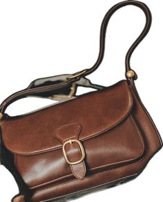 Timeless Brown Saddle Bag With Gold-tone Hardware, Elegant Brown Saddle Bag For Office, Classic Brown Saddle Bag With Hasp Closure, Retro Business Shoulder Bag With Gold-tone Hardware, Modern Brown Shoulder Bag With Brass Hardware, Timeless Brown Shoulder Bag With Detachable Strap, Elegant Brown Rectangular Saddle Bag, Elegant Rectangular Flap Bag With Brass Hardware, Elegant Flap Bag With Brass Hardware For Everyday Use