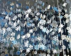 snowflakes are hanging on the side of a building