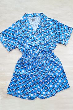 Our luxuriously soft Evil Eye Pajamas are perfect for weddings, bridal parties, holidays, getaways, bachelorette weekends, vacations, or just lounging at home. Features a button front shirt and elastic waist bottoms. Shorts feature hidden pockets. These pajamas are in production and require 5-6 weeks before shipment. Blue Printed Sleepwear For Lounging, Blue Sleepwear With Elastic Waistband For Lounging, Blue V-neck Sleepwear Set, Blue V-neck Sleep Set, Blue Relaxed Fit Sleepwear With Elastic Waistband, Blue V-neck Pajama Party Sets, Elastic Stretch Sleepwear With Waistband, Elastic Stretch Sleepwear With Waistband For Bedtime, Elastic Stretch Sleepwear For Bedtime