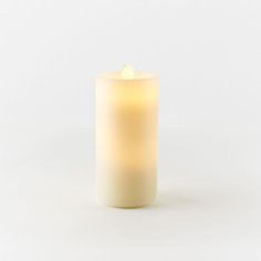 a lit candle on a white background