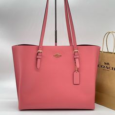 Brand New With Tag Coach Leather Mollie Shoulder Tote Bag Pebble Leather Color: Taffy Inside Multifunction Pocket Zip-Top Closure, Fabric Lining Handles With 10 1/4" Drop Side Open Compartments 13 1/4" (L) X 11" (H) X 5" (W) Luxury Large Capacity Pink Shoulder Bag, Pink Tote Shoulder Bag With Dust Bag, Pink Large Capacity Leather Bag, Large Capacity Pink Leather Bag, Luxury Pink Bag For On-the-go, Pink Double Handle Shopping Bag, Luxury Pink Bags For Everyday Use, Luxury Pink Bag For Everyday, Luxury Pink Everyday Bags