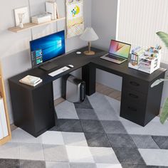 a computer desk with a laptop on top of it