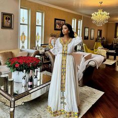 Beautiful Traditional Ethiopian Dress White Long Sleeve Maxi Dress For Navratri, Fitted White Kaftan For Transitional Season, Navratri Fitted Tunic Dress, Fitted Tunic Dress For Navratri, Long Yellow Dress For Festivals, Long Yellow Festival Dress, Long Yellow Dresses For Festivals, Yellow Dresses For Eid And Traditional Ceremonies, White Tunic Dress For Eid