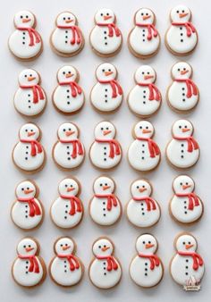 cookies decorated like snowmen with red bows on them and the words instagram written in white