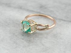 This is a beautiful vintage ring, a solitaire that is as lovely as it is versatile! Simple sweeps of gold grace the shoulders, providing a perfect balance to the gorgeous center stone! We've set a Colombian Emerald in this ring, a bright green gem with unbelievable shine! Incredibly clear and filled with light, this emerald is of exceptional quality, a one of a kind stone from our collection of Colombian gems that we're proud to offer! Metal: 14K Yellow and Rose Gold Gem: Emerald 1.56 Carat Gem Emerald Gold Engagement Ring, Beautiful Engagement Rings Vintage, Emerald Solitaire Ring, Columbian Emeralds, Beautiful Rings Vintage, Green Gem, Cushion Cut Ring, Colombian Emeralds, May Birthstone