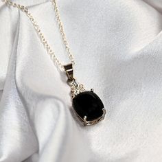 Black Onyx Women's Pendant Cabochon Stone With Moissanite Sterling Silver Chain Pendant For Women/Gift For Wife/Anniversary Gift For Wife. This striking pendant features a captivating black onyx cabochon adorned with sparkling moissanite stones, all set in high-quality silver. The design of the pendant elegantly combines the deep, rich hue of the black onyx with the brilliant sparkle of the moissanite, creating a sophisticated and eye-catching piece of jewelry. The black onyx cabochon serves as the focal point of the pendant, showcasing its smooth, polished surface and intense black color. The cabochon cut enhances the gemstone's natural luster and depth, creating a sense of elegance and refinement. Surrounding the black onyx are moissanite stones, strategically placed to add sparkle and b Handmade Gold Necklace, Silver Chain Pendant, Anniversary Gift For Wife, Black Onyx Necklace, Pendant For Women, Onyx Necklace, Anniversary Gifts For Wife, Cabochon Pendant, Handmade Gold