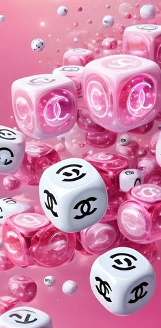 pink and white dices with eyes on them floating in the air next to bubbles