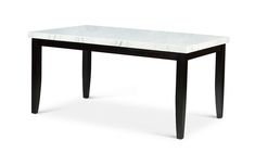 a white marble top table with black legs