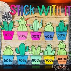 a wooden sign that says stick with it in front of cactuses and other plants