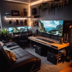 a living room filled with lots of furniture and a flat screen tv mounted to the wall