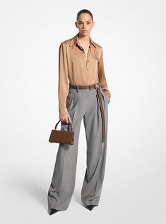 These wide-leg trousers combine timeless tailoring elements, like front pleats and crisp leg creases, with stretch-infused virgin wool sourced from an Italian mill. A high-rise fit evokes a strong feminine aesthetic. Balance its soft hand and languid drape with pointed-toe heels. Made in Italy. Luxury Wide Leg Pants With Belt Loops For Work, Fall Business Wide Leg Pants With Pressed Crease, Luxury Wide Leg Dress Pants For Work, Luxury Wide Leg Pants For Fall, Luxury High-waisted Wide Leg Pants For Fall, Luxury Tailored Wide Leg Pants For Workwear, Luxury Tailored Wide Leg Pants For Business Casual, Luxury Tailored Wide Leg Pants For Fall, Luxury Tailored Wide Leg Pants For Office