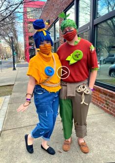 two people in costumes standing next to each other