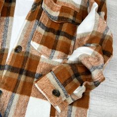 Experience ultimate comfort and style with our Wool Blend Plaid Button Up Shacket. This oversized shacket combines the warmth of wool with the comfort of a shirt, making it perfect for any chilly day. Winter Everyday Shacket With Snap Buttons, Everyday Winter Shacket With Snap Buttons, Oversized Winter Shacket With Pockets, Winter Plaid Collared Shacket, Plaid Single Breasted Shacket For Winter, Plaid Single-breasted Shacket For Winter, Oversized Winter Shacket For Cold Weather, Plaid Button-up Winter Outerwear, Oversized Brown Outerwear With Buttoned Pockets