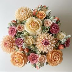 an arrangement of flowers is displayed on a white background with the words petals bakehouse