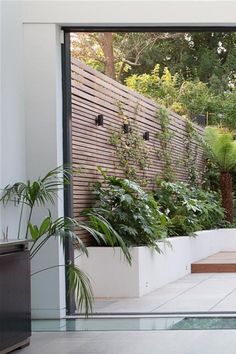 an outdoor living area with large sliding glass doors