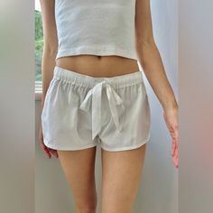 Nwt Brandy Melville Soft Cotton Pajama Shorts With Two Button Details, An Elastic Waistband, And Silk Drawstring. Says It Is A Size S/M On The Website, But Fits More Like A Small And Is Low Rise. So Comfy And Cozy! Summer Pajama Shorts For Loungewear, Summer Loungewear Pajama Shorts, Sleep Shorts With Elastic Waistband, White Sleepwear With Built-in Shorts, Elastic Waistband Bottoms For Bedtime, Short Length Bottoms With Elastic Waistband For Bedtime, Summer Pajama Shorts With Elastic Waistband For Pajama Party, Summer Sleep Shorts, Summer Bottoms With Elastic Waistband For Sleepovers