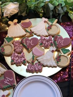 decorated cookies are arranged on a plate