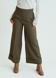 Odeeh's Wool Poplin Pants are crafted of 100% wool and feature a wide, cropped leg with a deep cuff. Details Hidden zip and tab closure. Wide, cropped leg. Deep pant cuff. Hip and rear pockets. Dry clean. Made in Germany. Color dark khaki. 100% virgin wool. Poplin Pants, Cuffed Pants, Dark Khaki, British Indian, Sale Design, Brunei, Casual Pants, New Dress, Knitwear