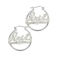 These fashionable nameplate hoop earrings are perfect for any occasion and everyday wear. You have up to ten characters to personalize your nameplate with the name of a loved one or your own. This sweetheart style features an eye-catching design of a smooth hoop earring and shimmering beaded rhodium nameplate that sparkles and wows. A glistening, winding underline with a heart in the center completes these earrings and makes them the perfect gift for a loved one. These nameplate hoop earrings ar Personalized Silver Metal Hoop Earrings, Personalized Silver Earrings For Birthday, Customizable Silver Earrings For Personalized Gift, Custom Name Silver Nameplate Earrings, Custom Name Silver Earrings For Anniversary, Silver Personalized Name Earrings For Gifts, Personalized Silver Earrings With Custom Name, Custom Name Sterling Silver Earrings, Customizable Silver Hoop Earrings