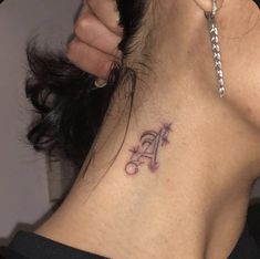 a woman with a tattoo on her neck