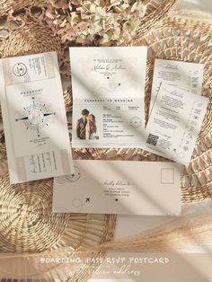 the wedding stationery is laid out on a wicker basket with flowers in it