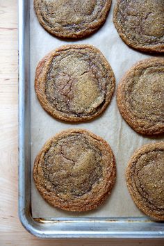 six cookies on a baking sheet ready to be baked